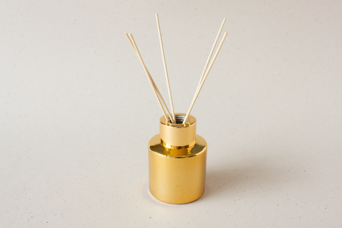 Rond parfumflesje - goud met gouden sierring - per 6 ex.