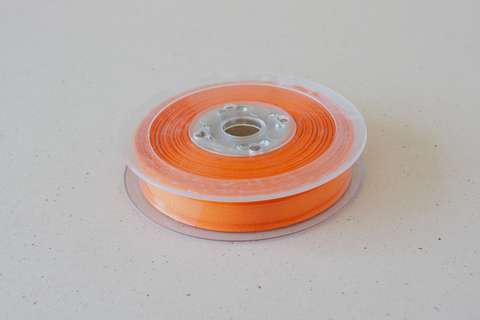 Semi transparant lint 'oranje' - 15 mm - rol van 25 m